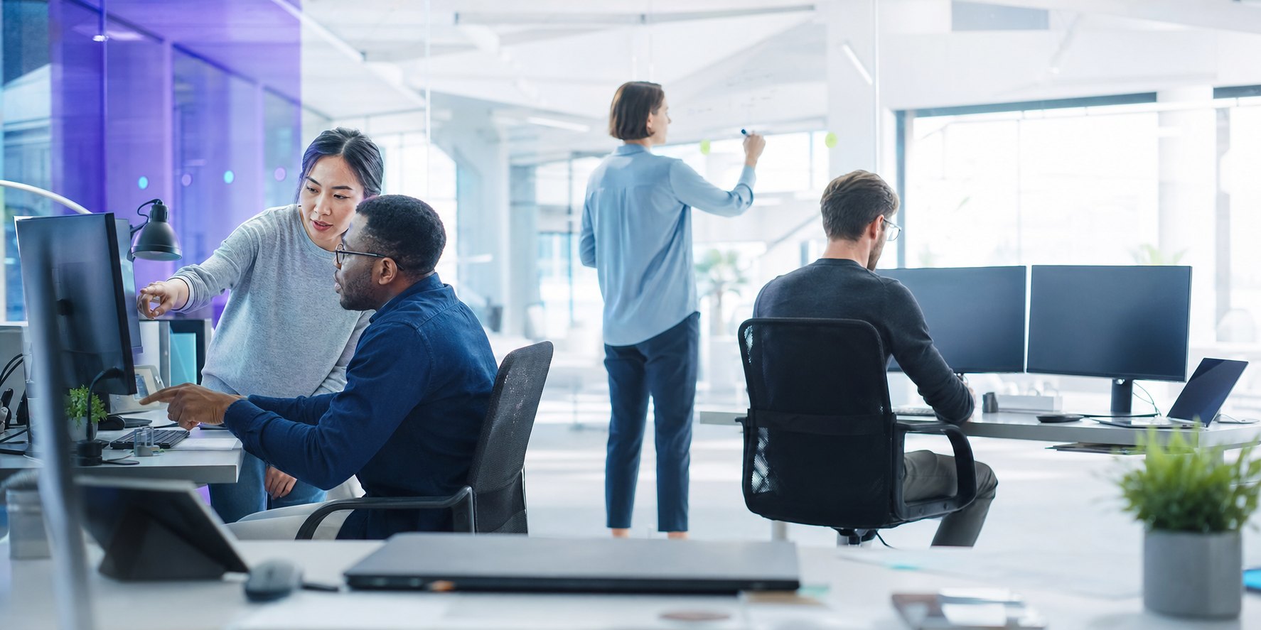Software engineers collaborating in a bright modern technology office